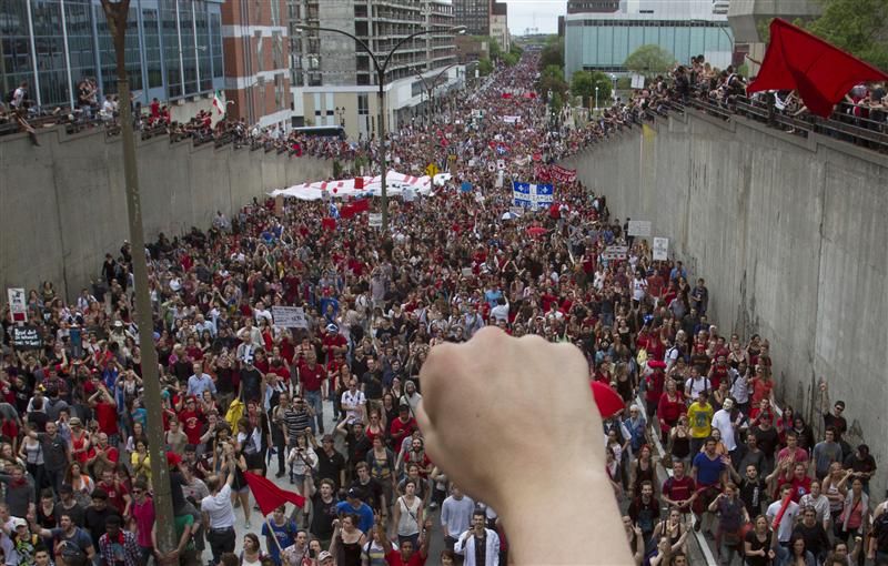 Thousands of demonstrators march against tuition hikes marking 100 days of protest in  downtown Montreal